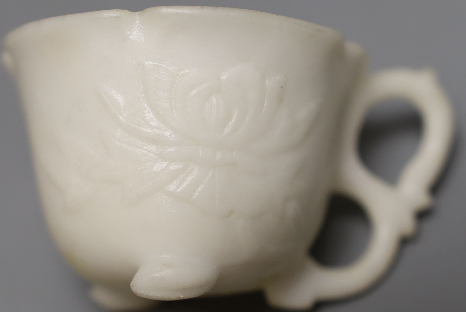 A White hardstone tea cup and saucer - 5cm tall